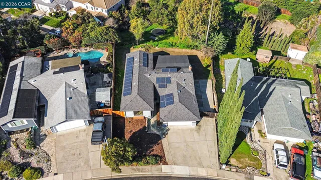 an aerial view of houses with outdoor space