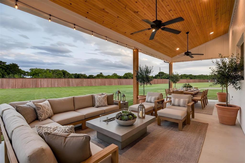 7798 Barber Rnch Road Fort Worth, TX 76126 - Photo 38 of 40 a roof deck with couches and potted plants