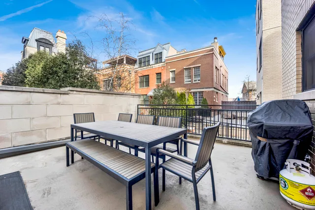 a view of a balcony with chairs