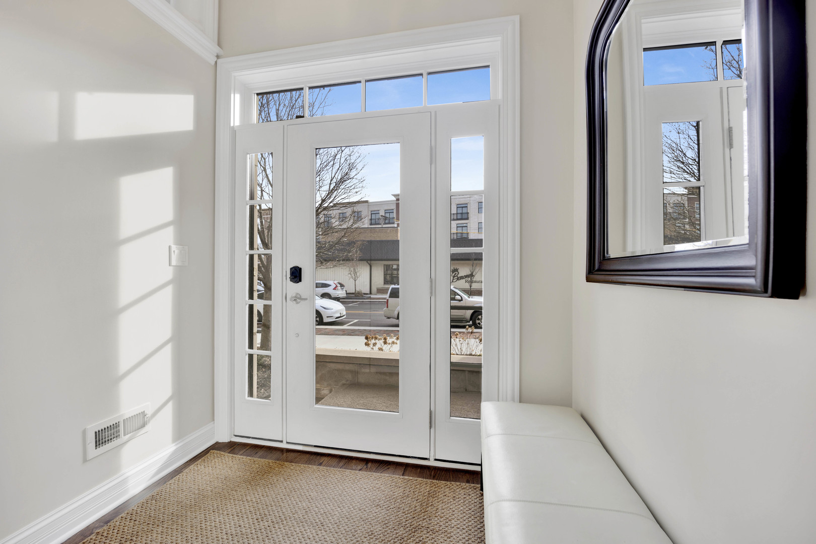 460 Pennsylvania Avenue, Unit C Glen Ellyn, IL 60137 - Photo 3 of 37 a view of a hallway with bathroom and front door