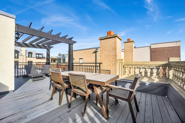 a living room with couch and a wooden floor