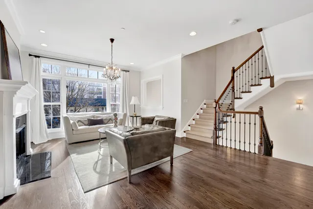 a living room with furniture fireplace and flat screen tv