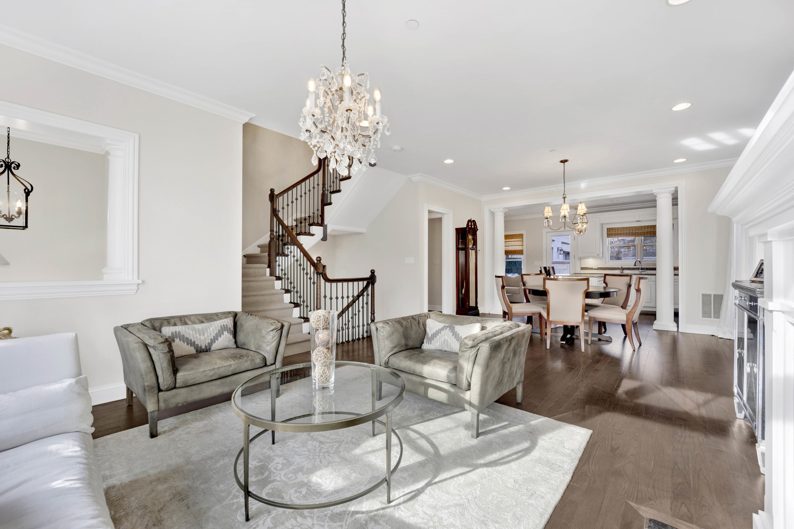 460 Pennsylvania Avenue, Unit C Glen Ellyn, IL 60137 - Photo 6 of 37 a living room with lots of furniture and a chandelier