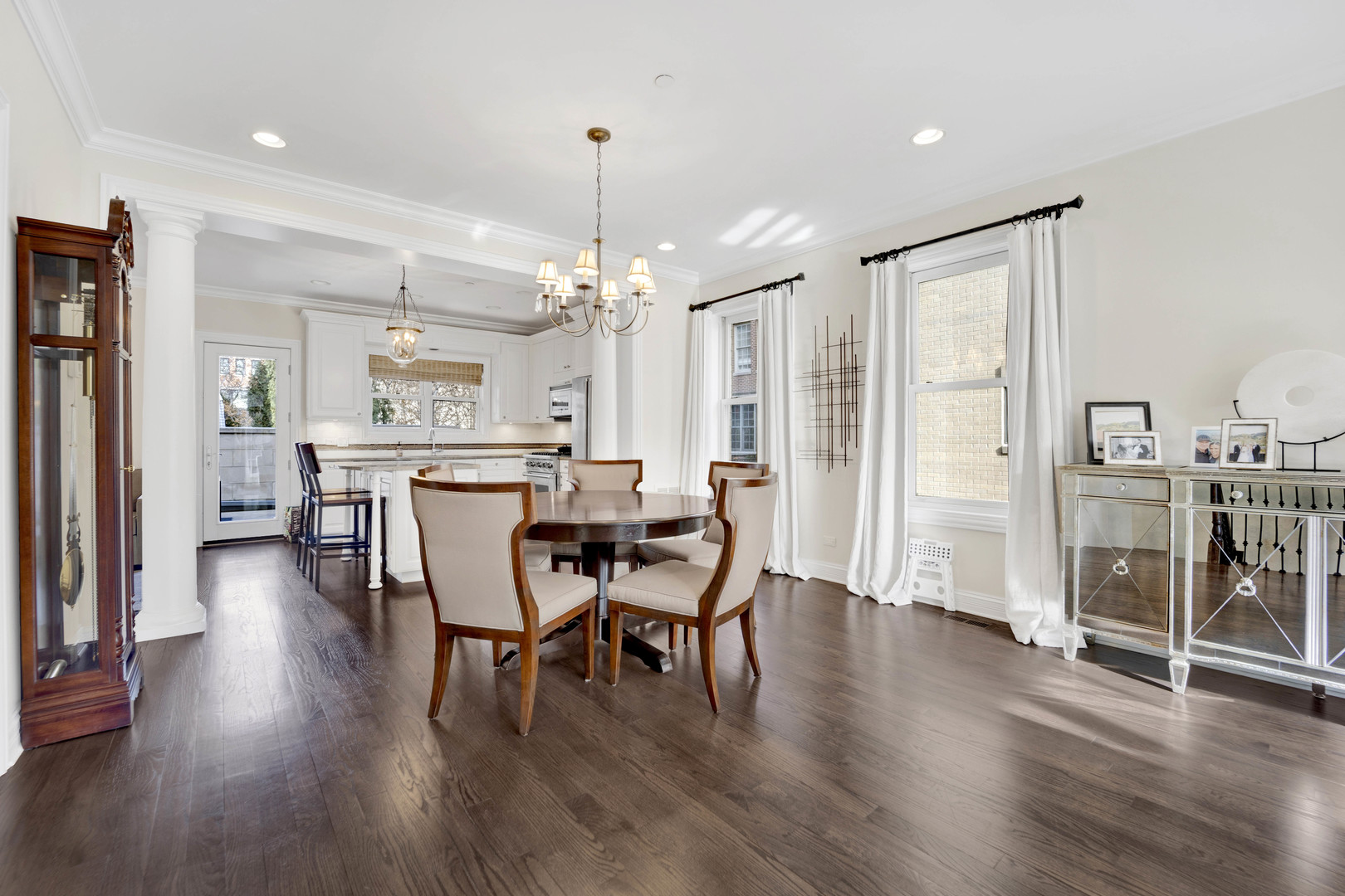 460 Pennsylvania Avenue, Unit C Glen Ellyn, IL 60137 - Photo 7 of 37 a view of a dining room with furniture and wooden floor