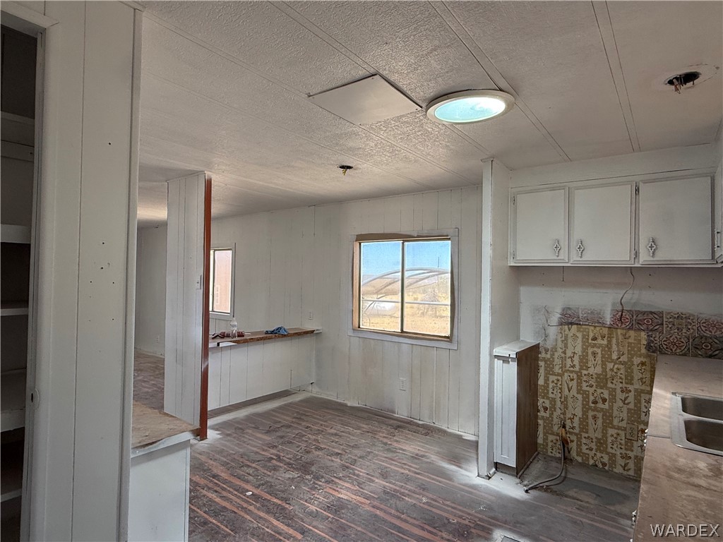 8051 7th Street Dolan Springs, AZ 86441 - Photo 20 of 65 a view of a livingroom with wooden floor and a window