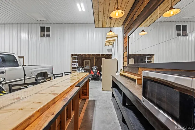 a kitchen with stainless steel appliances a sink stove and cabinets