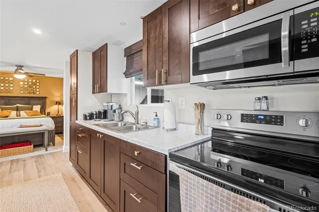 a kitchen with stainless steel appliances and cabinets