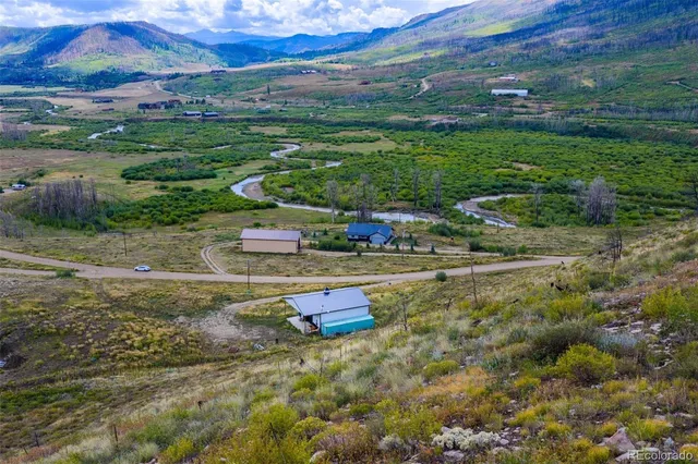 a swimming pool with trees in the background