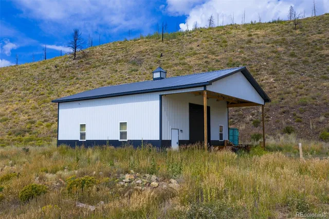 a house with trees in the background