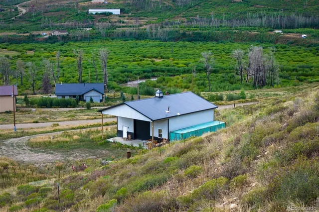 a aerial view of a house with a yard