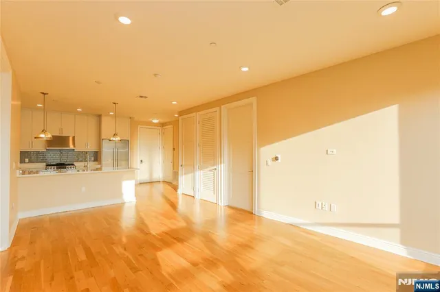 a kitchen with stainless steel appliances granite countertop a sink and cabinets