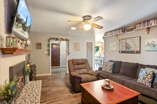 a living room with furniture and a fireplace