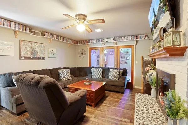 a living room with furniture and a fireplace