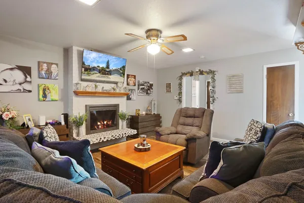 a living room with furniture and a fireplace