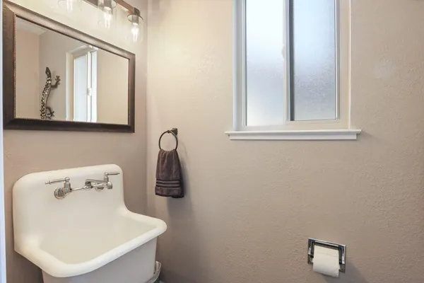 a bathroom with a sink and a mirror