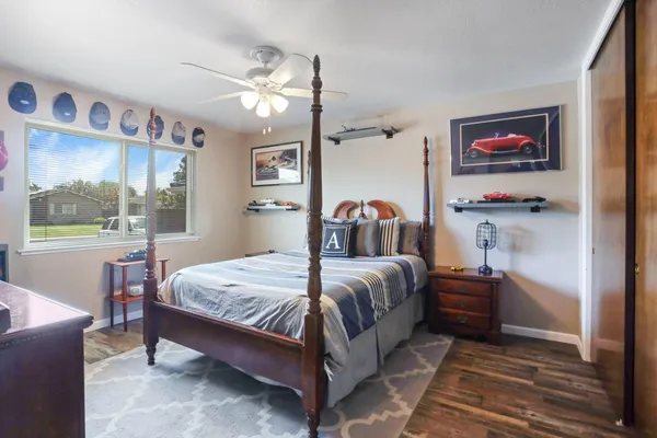 a bedroom with a bed and a table in it