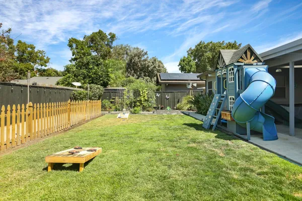a backyard of a house with outdoor seating