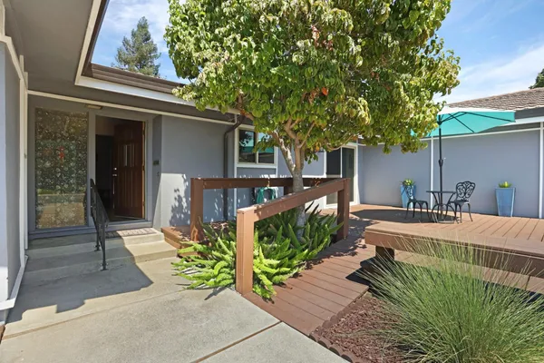 a front view of a house with garden