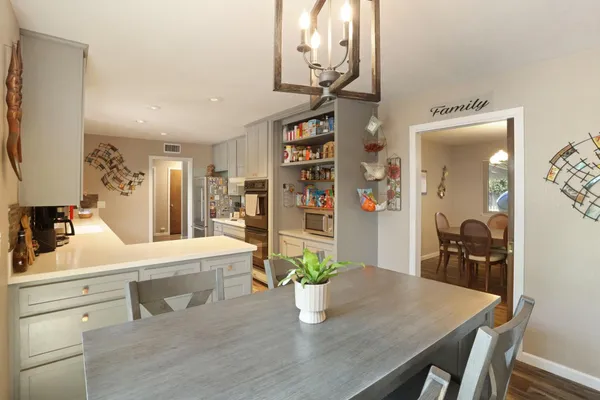 a dining room with furniture and window