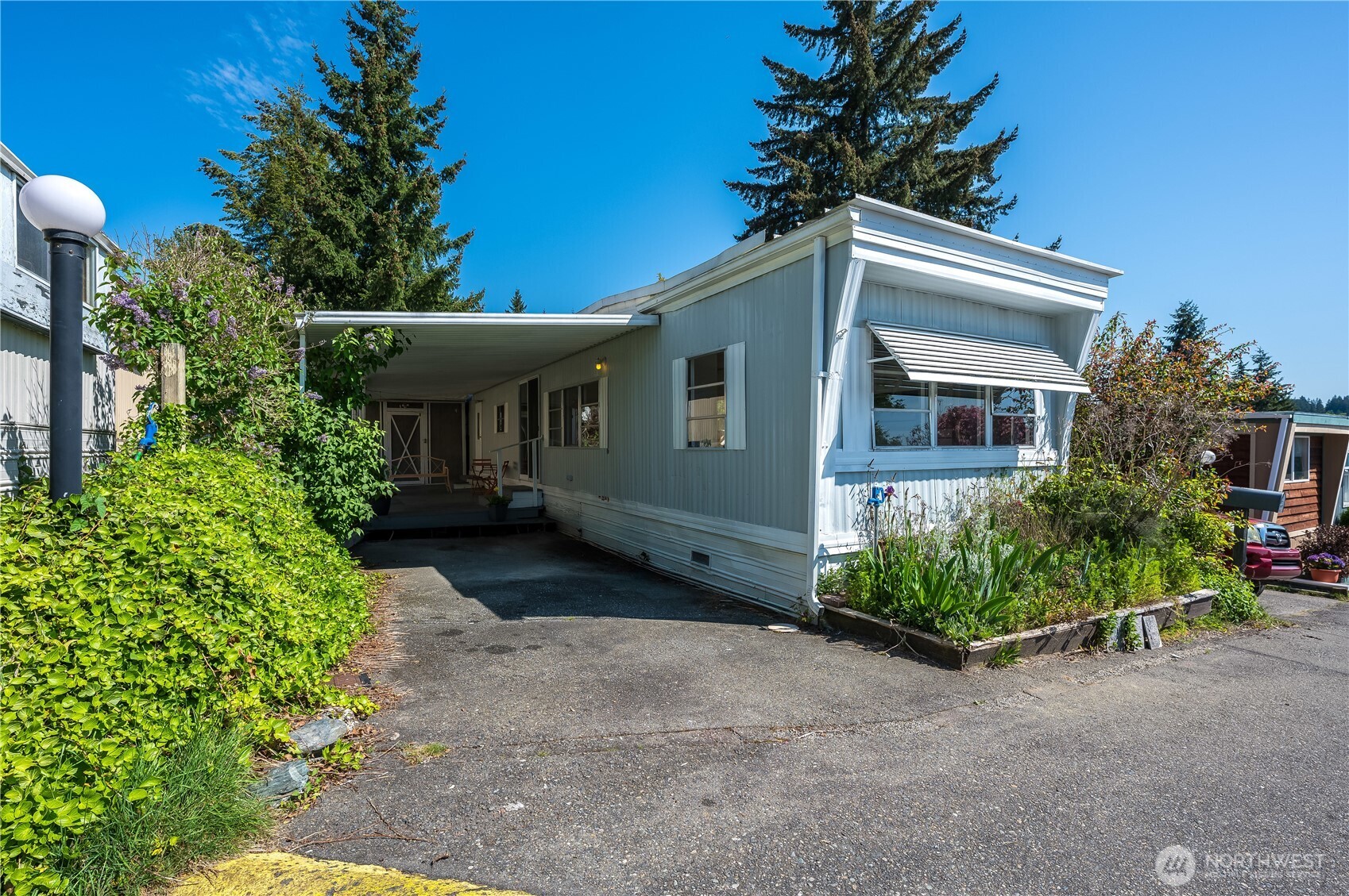 23708 Locust Way, Unit 29 Bothell, WA 98021 - Photo 1 of 1 a front view of a house with garden