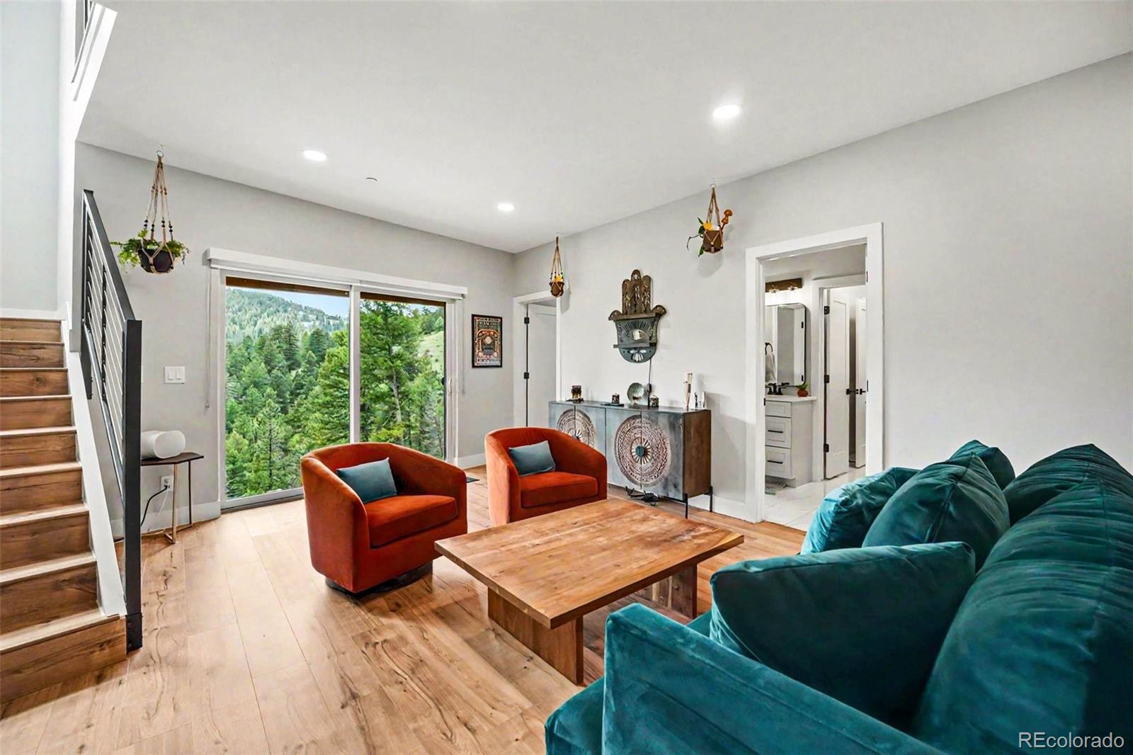 7231 Timber Trail Road Evergreen, CO 80439 - Photo 3 of 35 a living room with furniture and a large window