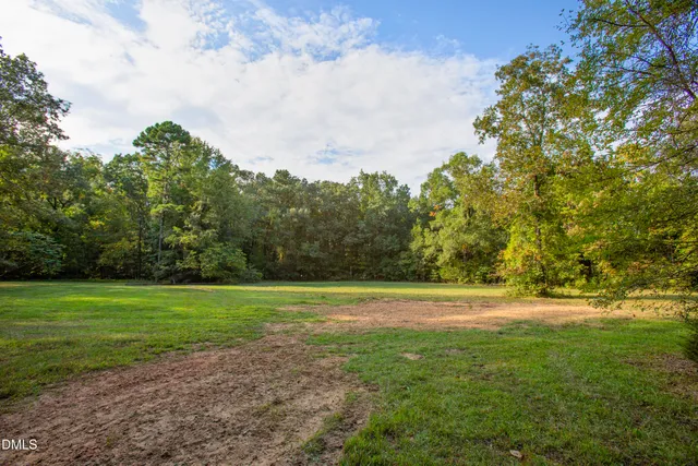 a view of a field with a big yard