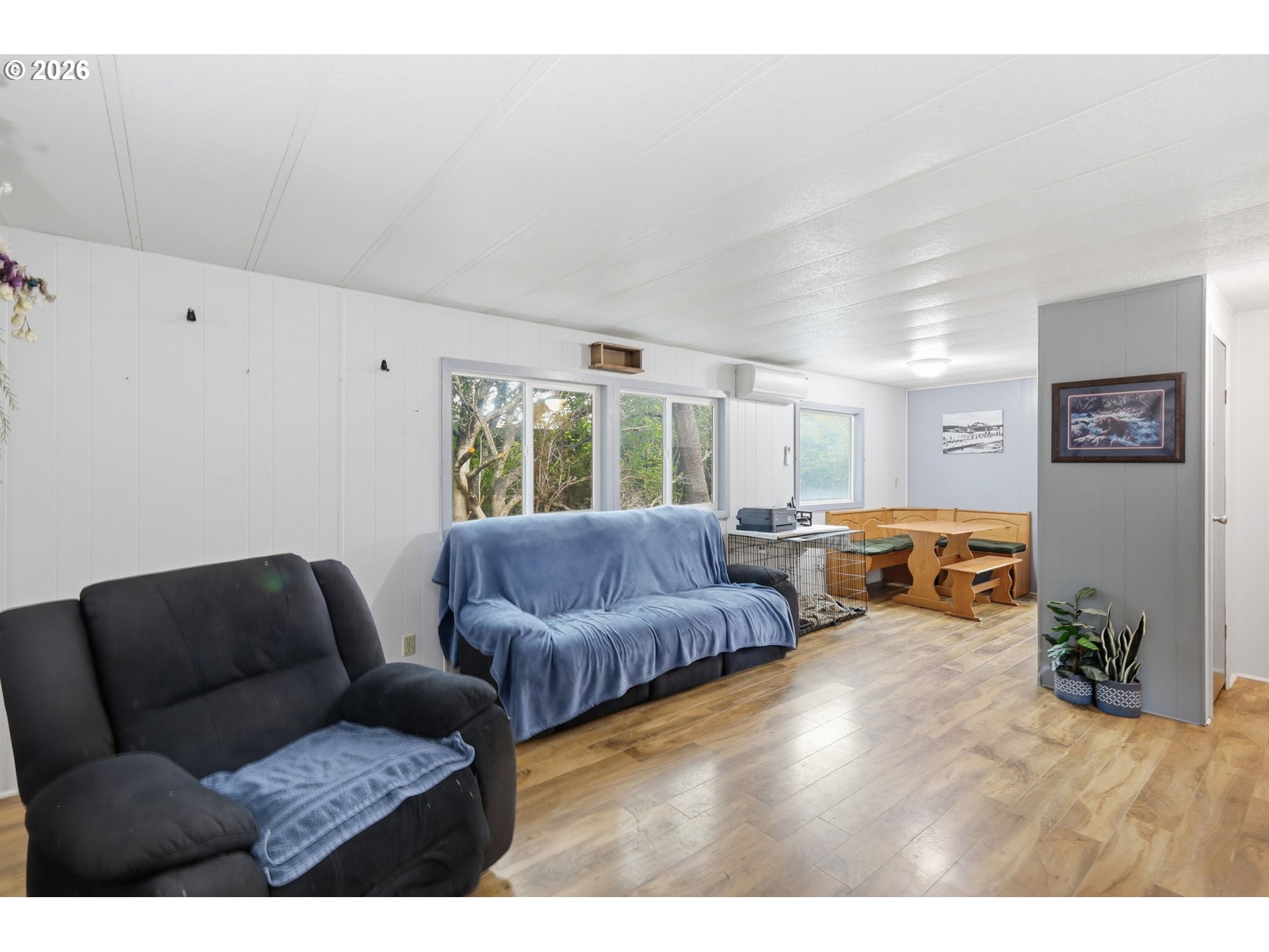 1600 Rhododendron Drive, Unit 76 Florence, OR 97439 - Photo 14 of 36 a living room with furniture and a large window