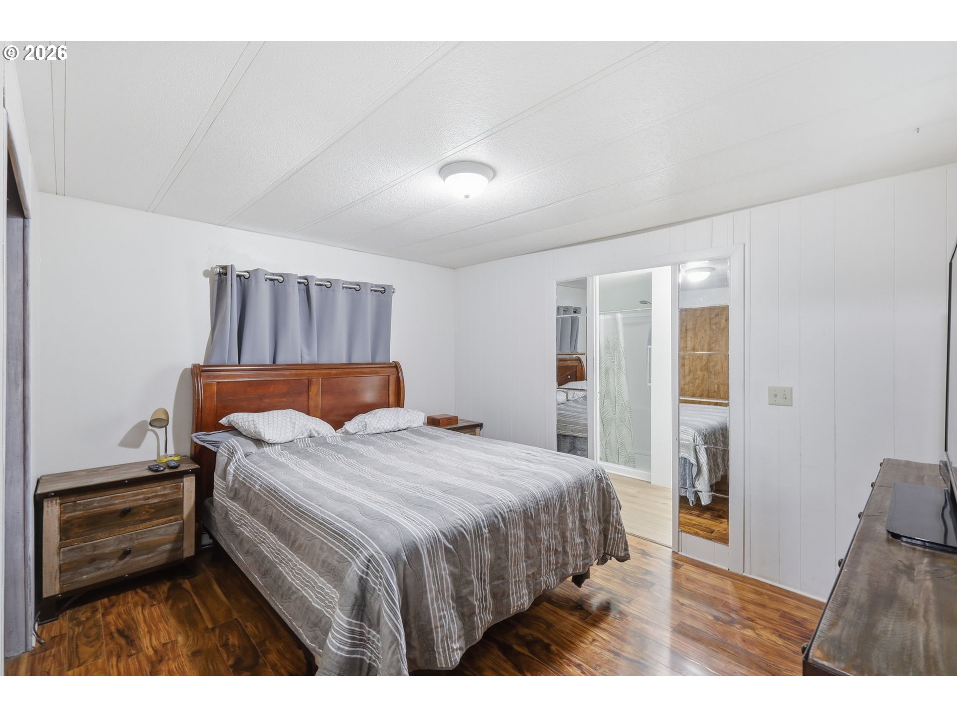 1600 Rhododendron Drive, Unit 76 Florence, OR 97439 - Photo 15 of 36 a bedroom with a bed and a view of kitchen