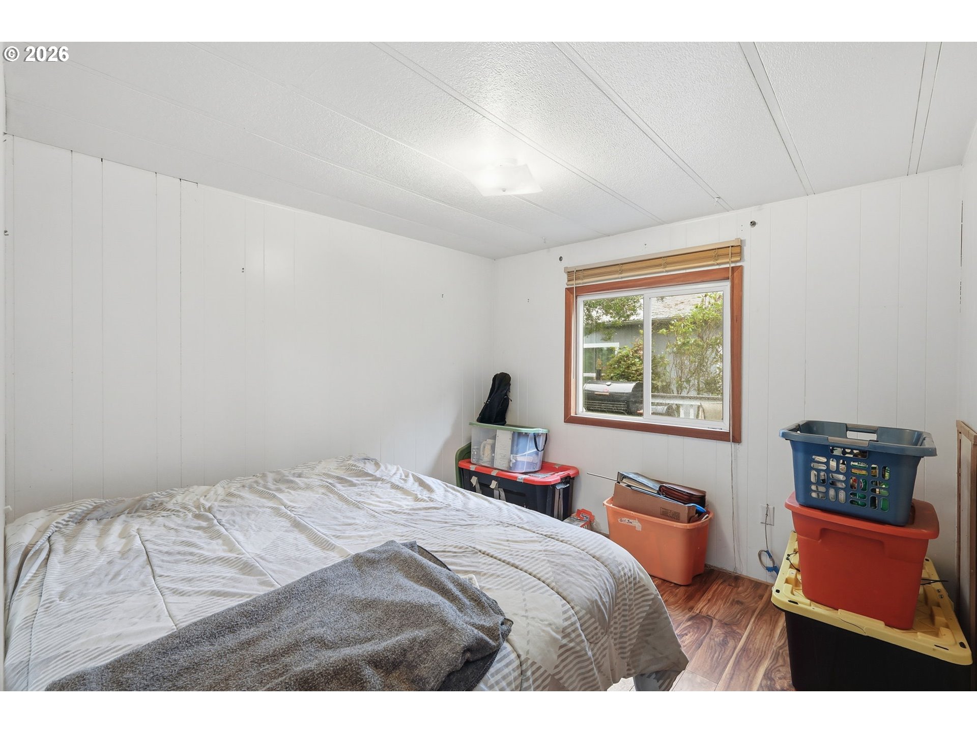 1600 Rhododendron Drive, Unit 76 Florence, OR 97439 - Photo 19 of 36 a bedroom with a bed and a window