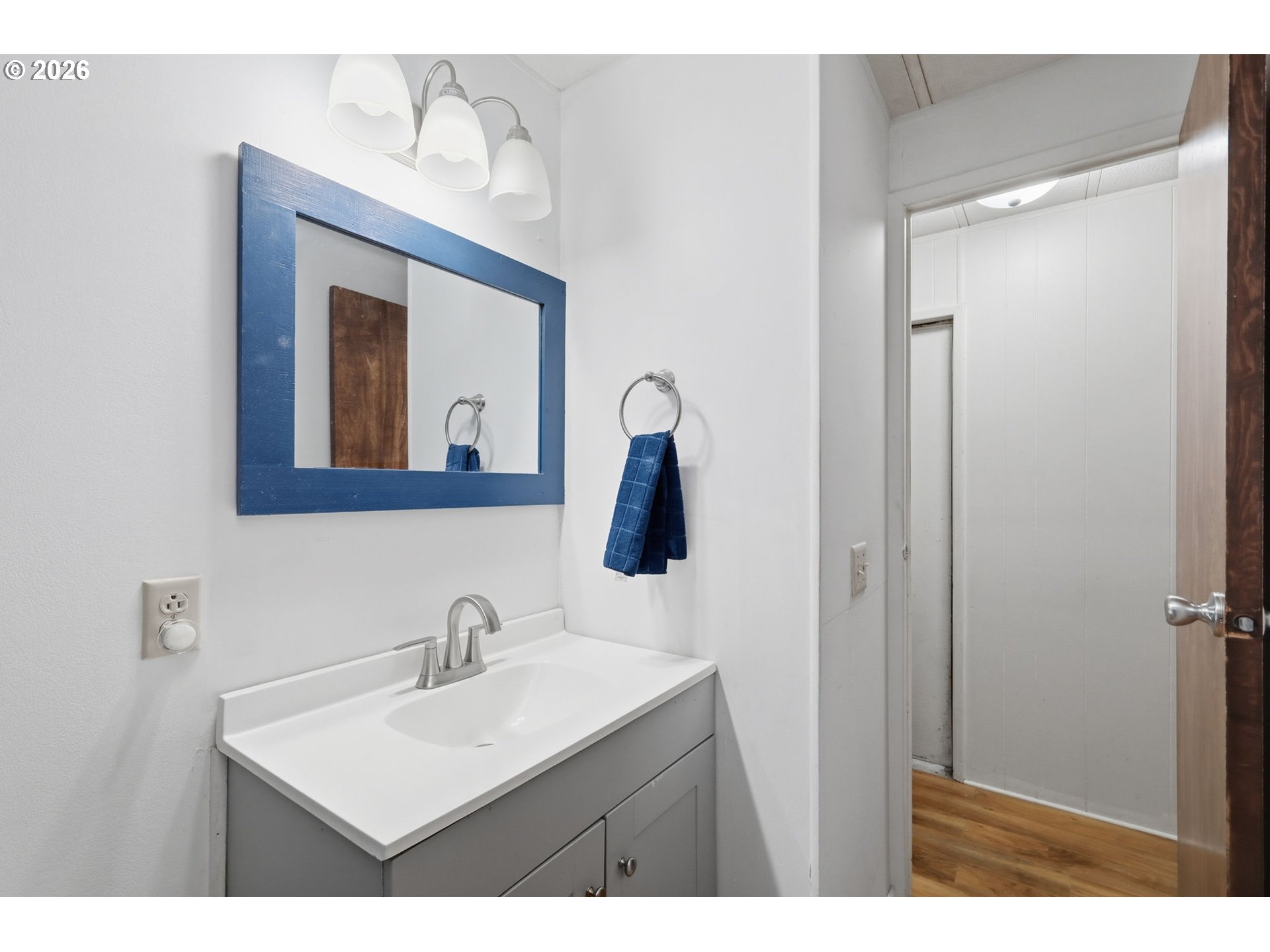1600 Rhododendron Drive, Unit 76 Florence, OR 97439 - Photo 22 of 36 a bathroom with a sink vanity and mirror