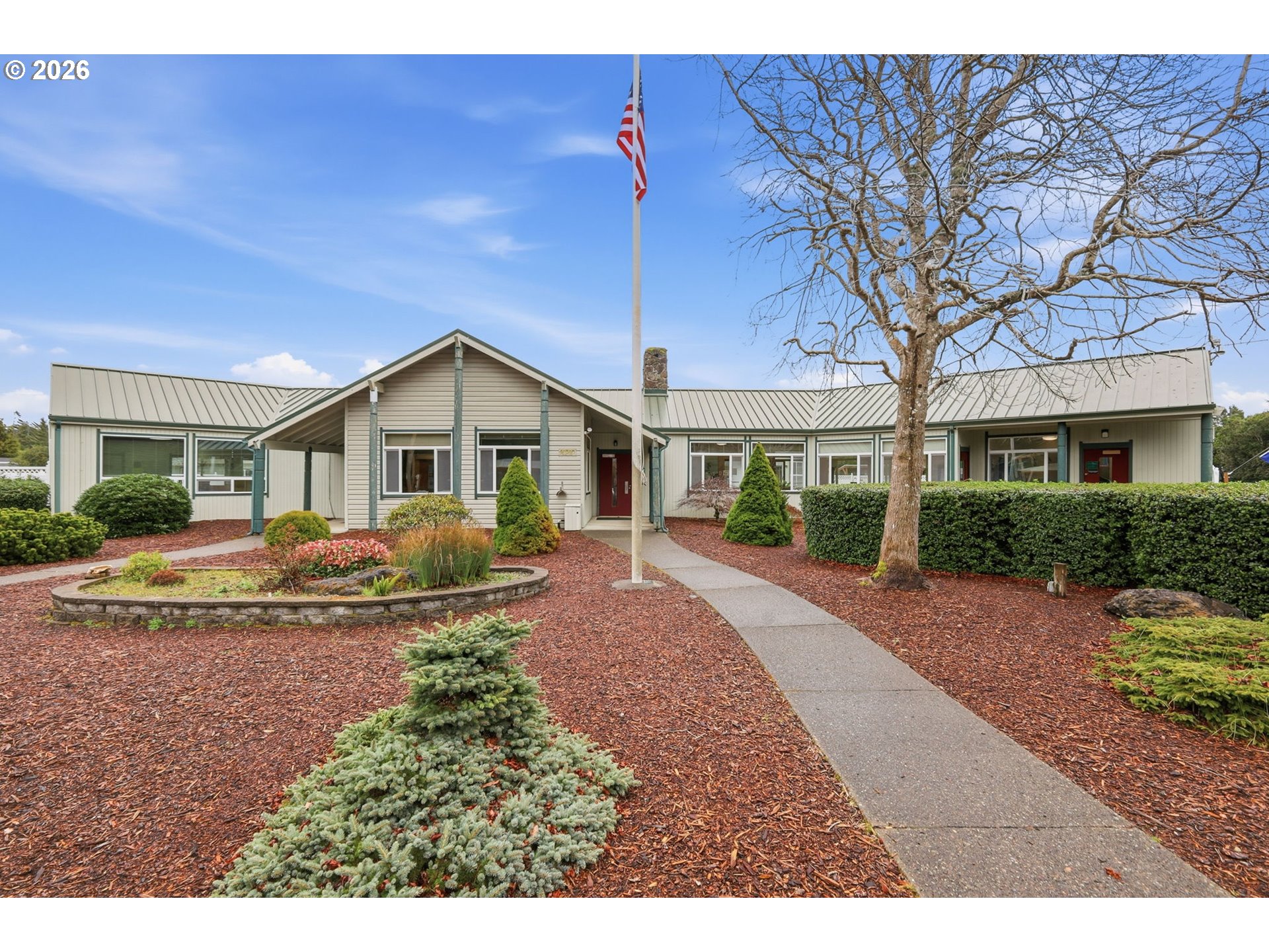 1600 Rhododendron Drive, Unit 76 Florence, OR 97439 - Photo 25 of 36 a view of a house with a yard