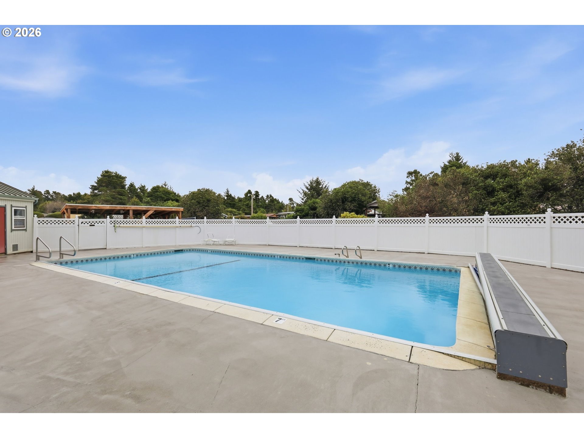 1600 Rhododendron Drive, Unit 76 Florence, OR 97439 - Photo 26 of 36 a view of a swimming pool and outdoor space