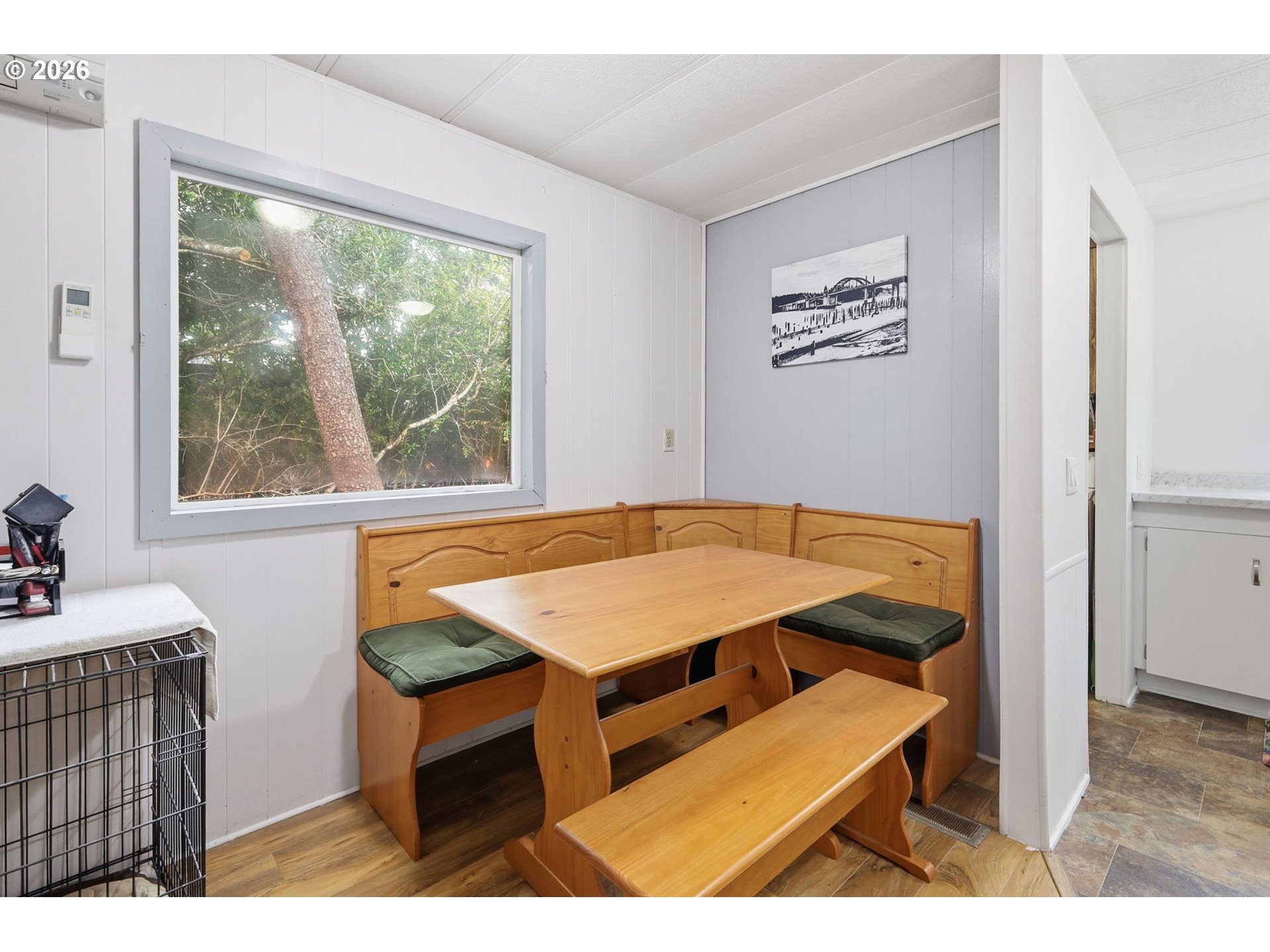 1600 Rhododendron Drive, Unit 76 Florence, OR 97439 - Photo 10 of 36 a living room with a table a window and a dining table