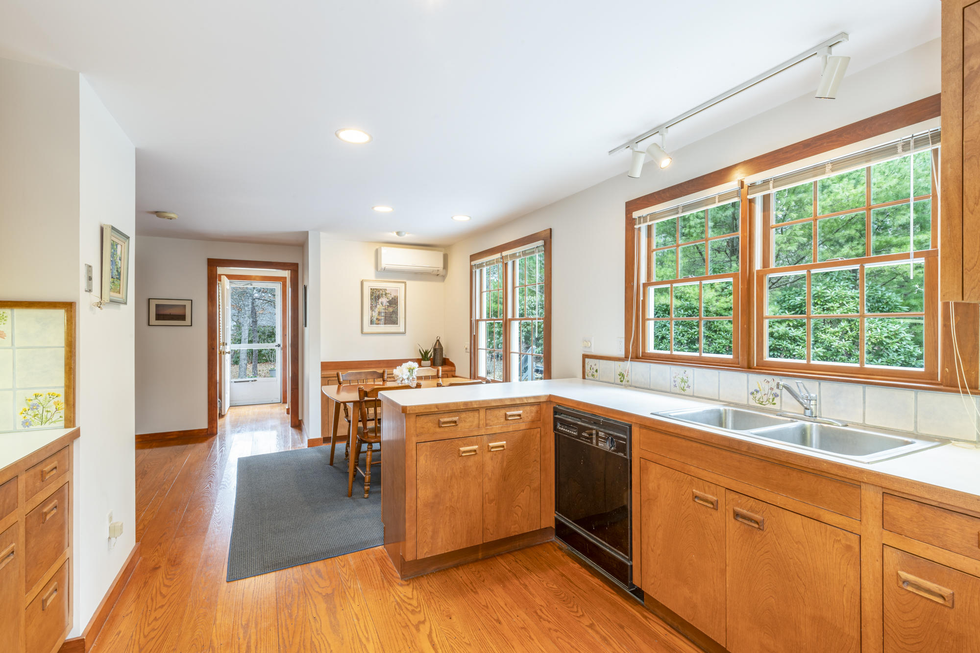 138 Namequoit Road Orleans, MA 02653 - Photo 13 of 50 a large kitchen with stainless steel appliances granite countertop a sink and cabinets