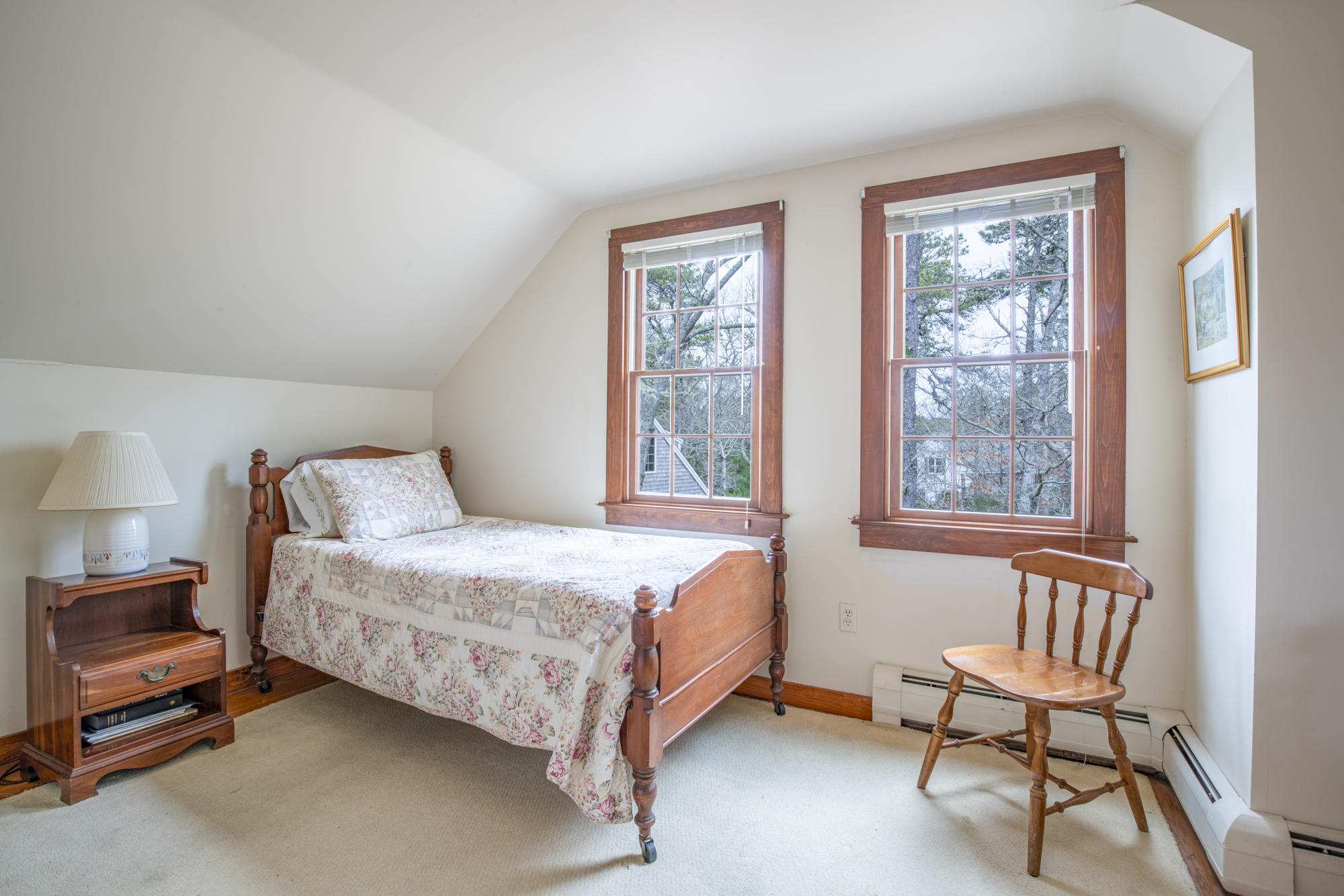 138 Namequoit Road Orleans, MA 02653 - Photo 19 of 50 a bedroom with a bed chair and window