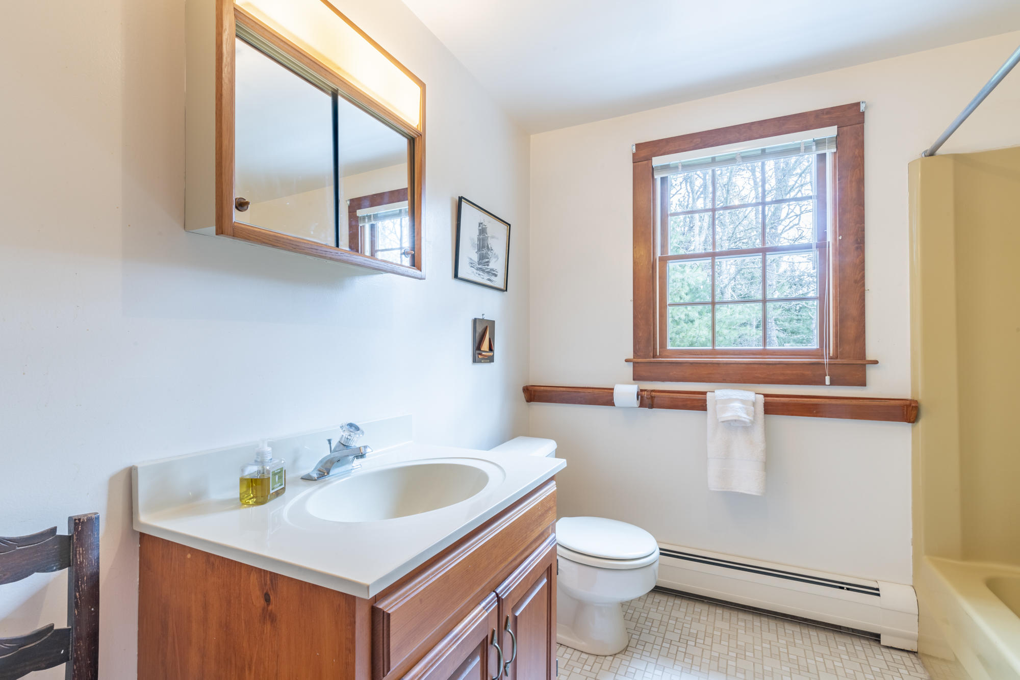 138 Namequoit Road Orleans, MA 02653 - Photo 21 of 50 a bathroom with a sink toilet and a window