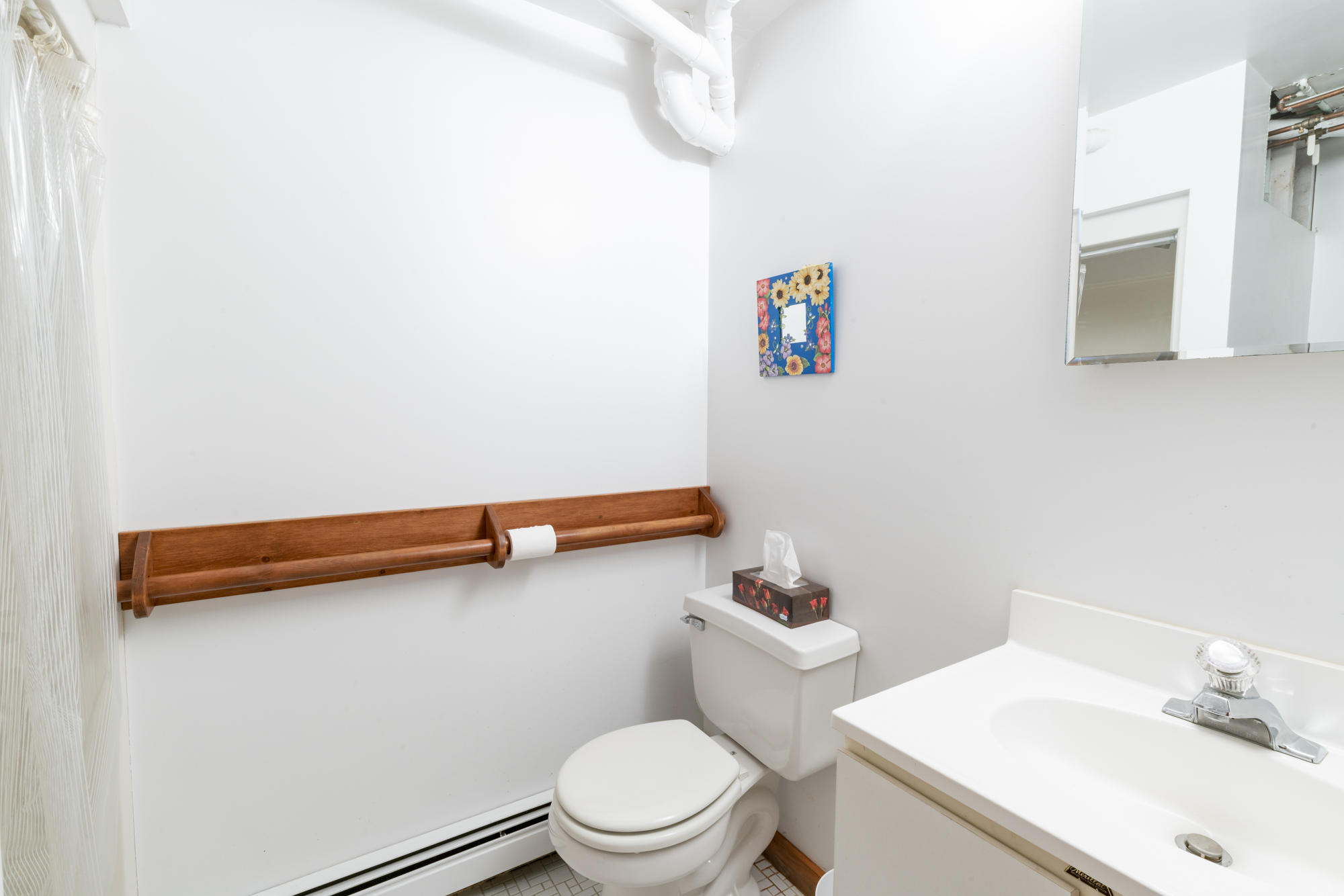 138 Namequoit Road Orleans, MA 02653 - Photo 24 of 50 a white toilet sitting next to a bathroom sink
