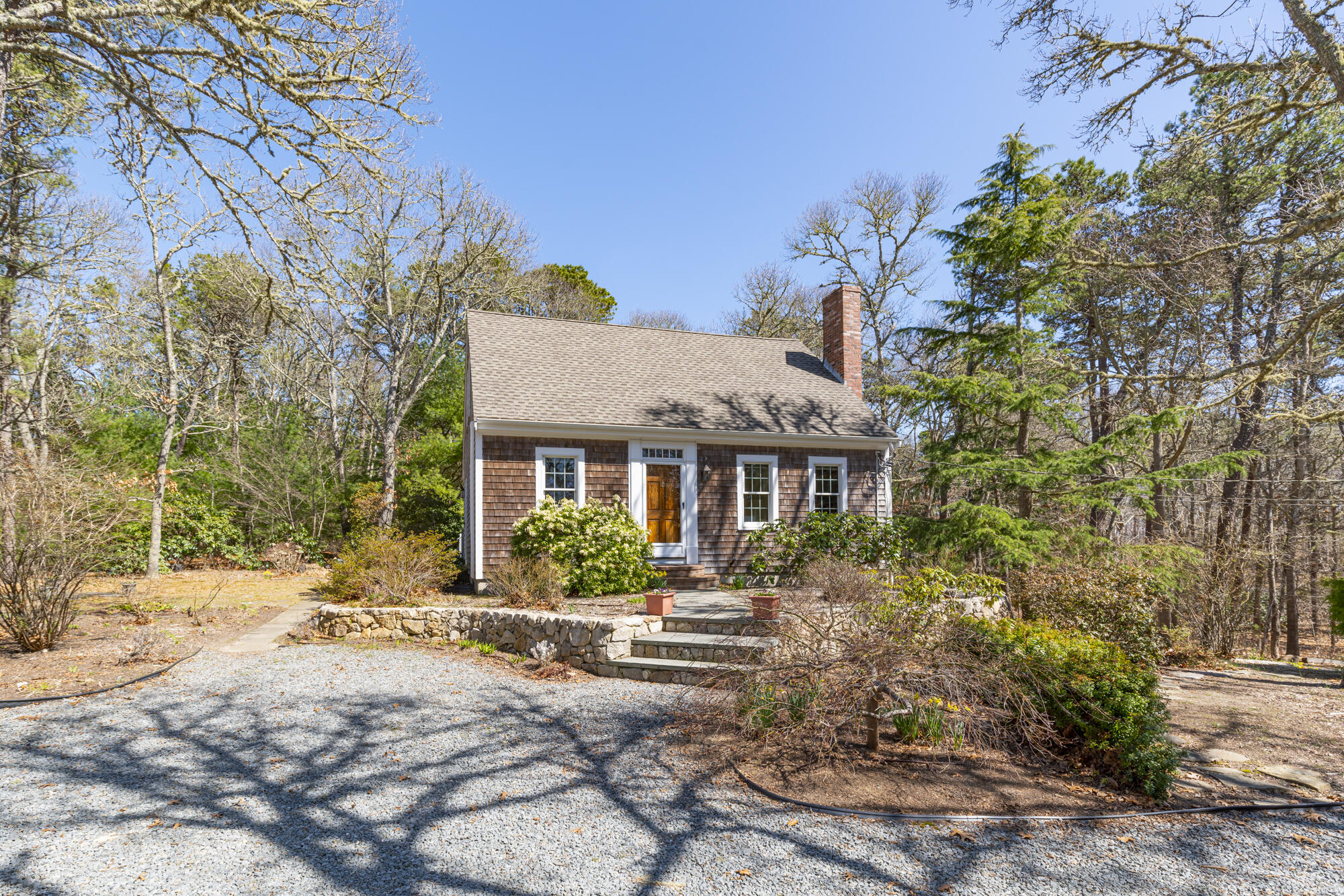 138 Namequoit Road Orleans, MA 02653 - Photo 26 of 50 a front view of a house with a yard