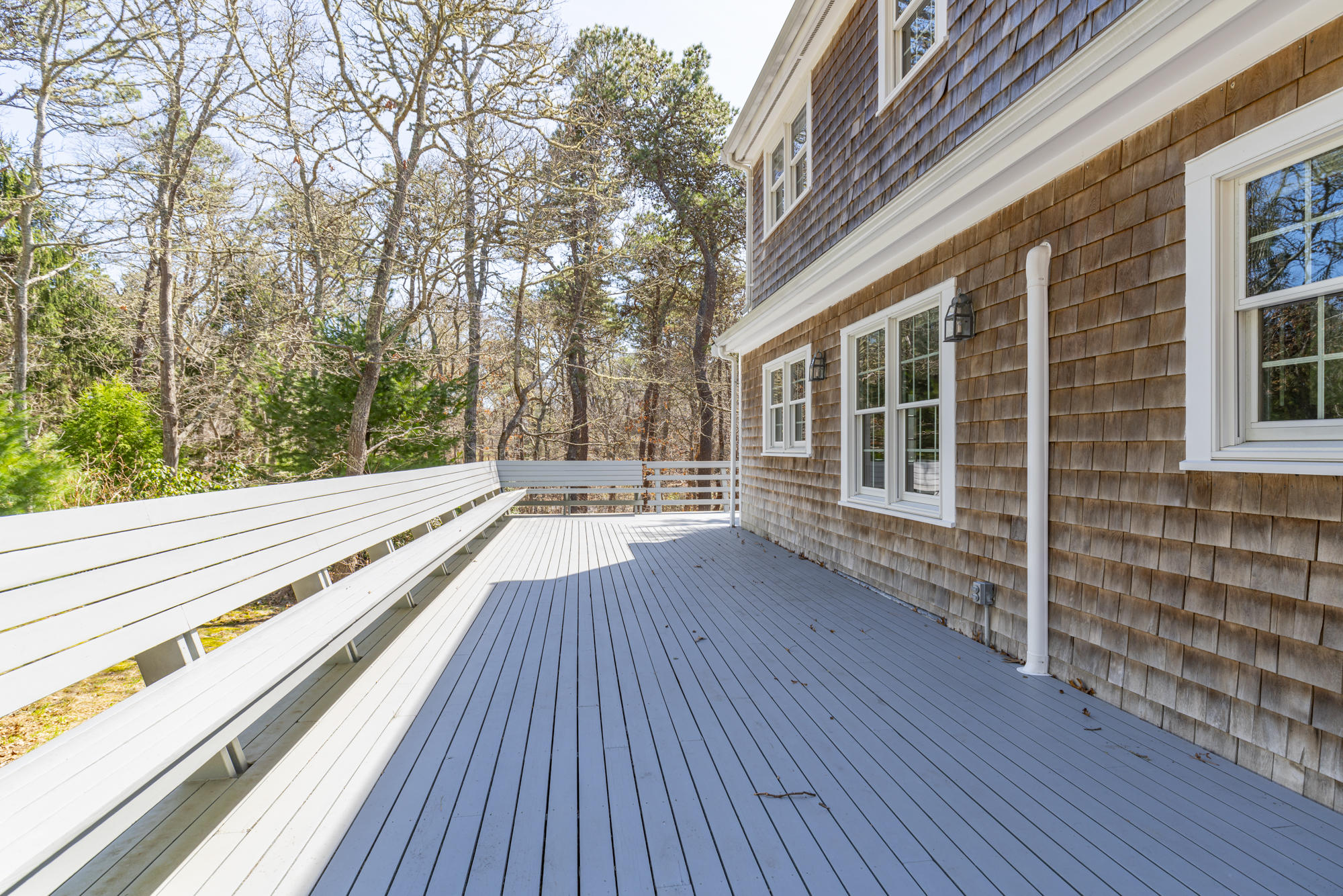 138 Namequoit Road Orleans, MA 02653 - Photo 29 of 50 a view of balcony with wooden floor and fence and a wooden bench