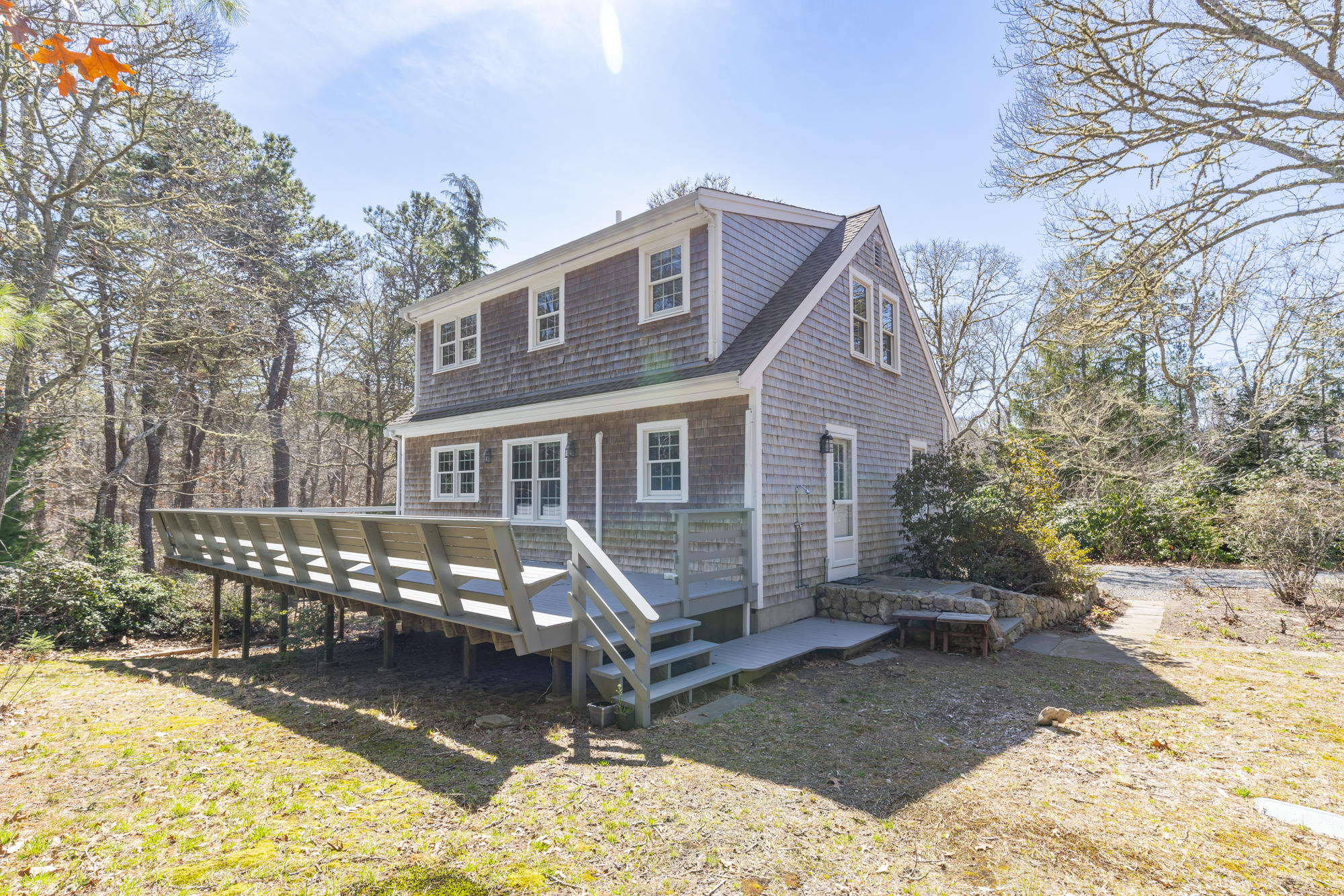 138 Namequoit Road Orleans, MA 02653 - Photo 3 of 50 a front view of a house with a yard patio and outdoor seating