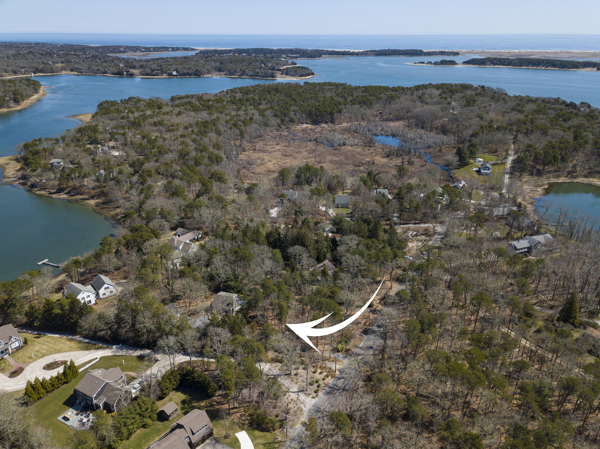 138 Namequoit Road Orleans, MA 02653 - Photo 47 of 50 a view of a lake with beach and city view