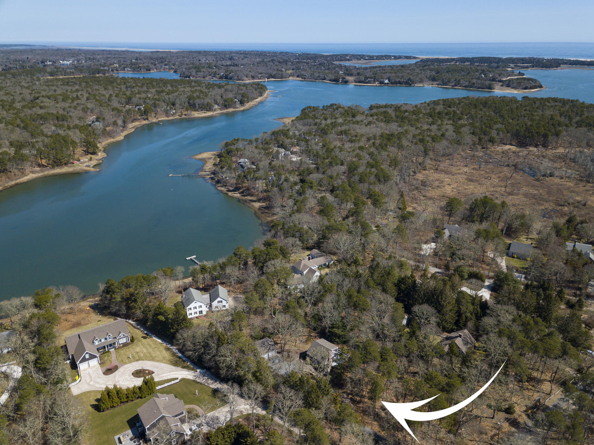 138 Namequoit Road Orleans, MA 02653 - Photo 5 of 50 a view of a lake with a mountain in the background