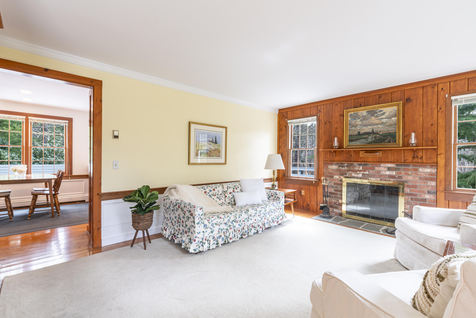 138 Namequoit Road Orleans, MA 02653 - Photo 9 of 50 a living room with furniture and a fireplace