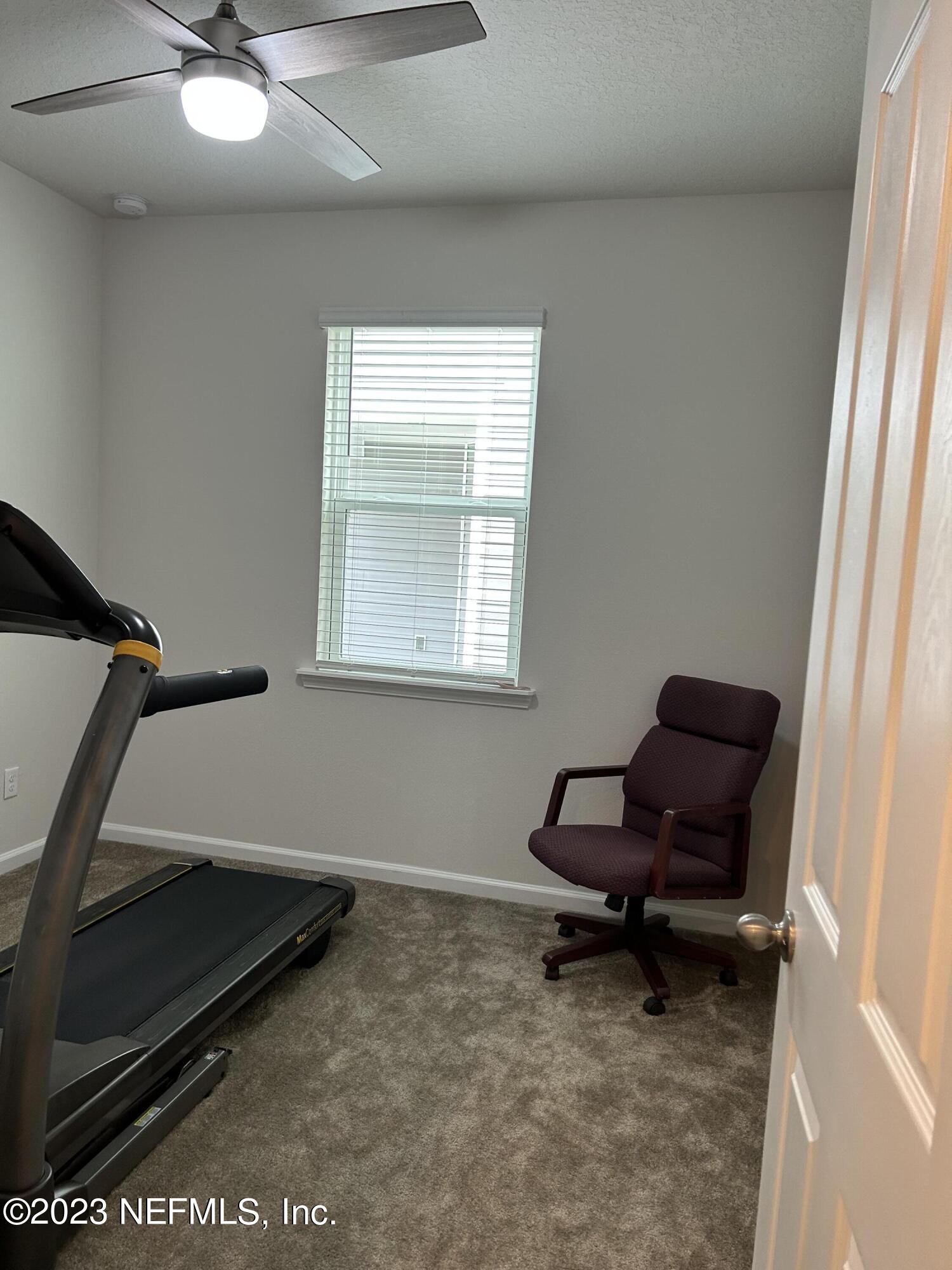 7109 Red Timber Road Jacksonville, FL 32244 - Photo 10 of 18 a living room with furniture and a window