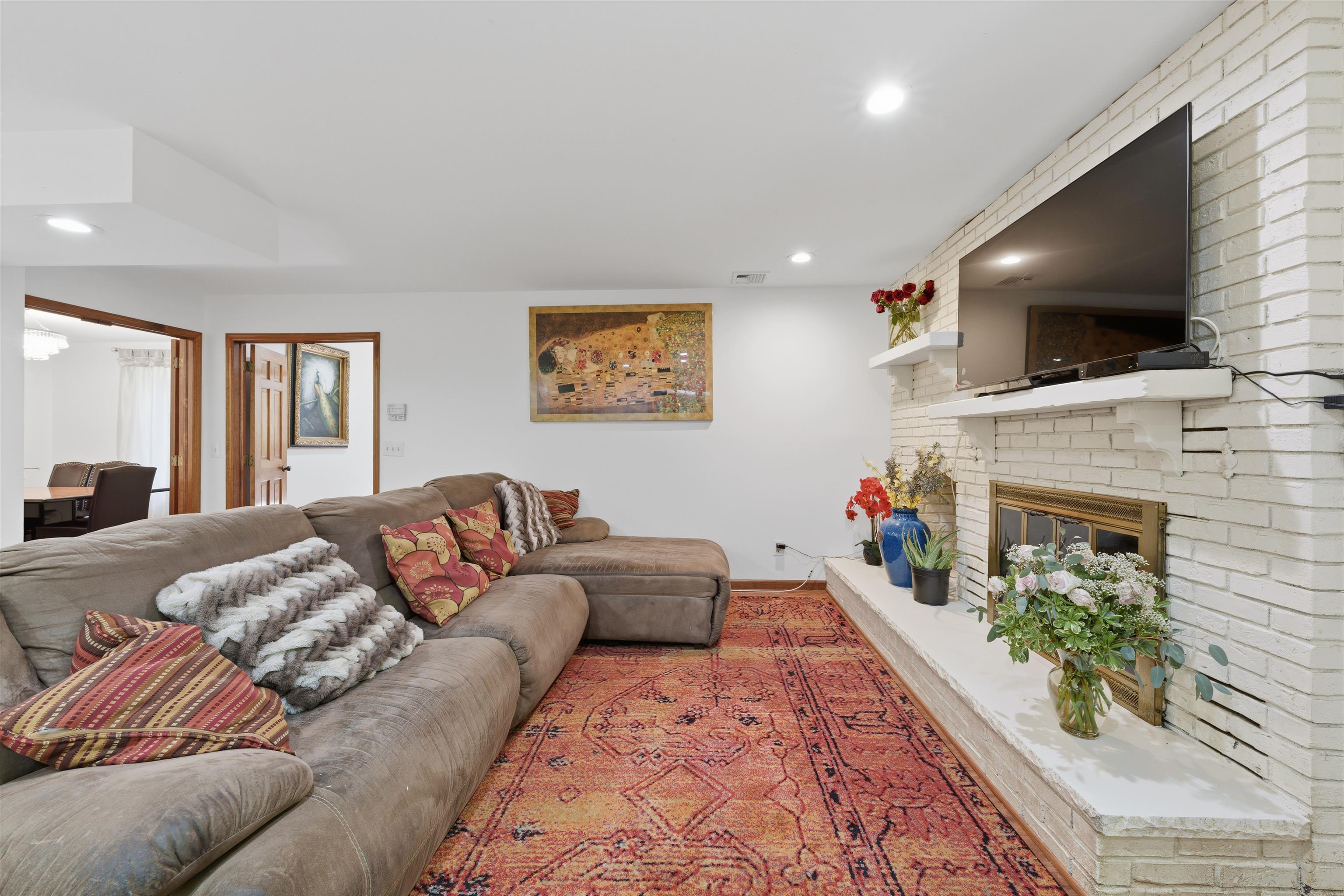 2 Carol Road Butler, NJ 07405 - Photo 14 of 49 a living room with furniture and a flat screen tv