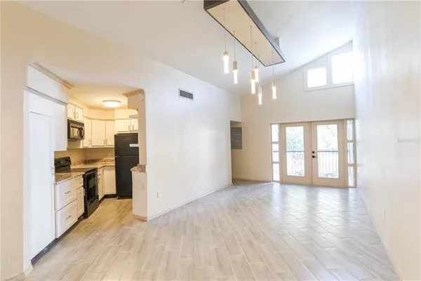 a view of a kitchen with a stove top oven