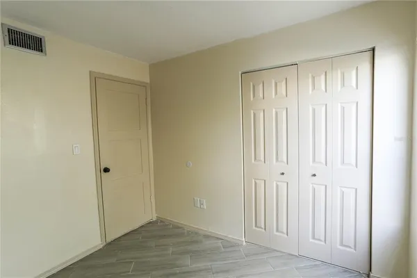an empty room with wooden floor