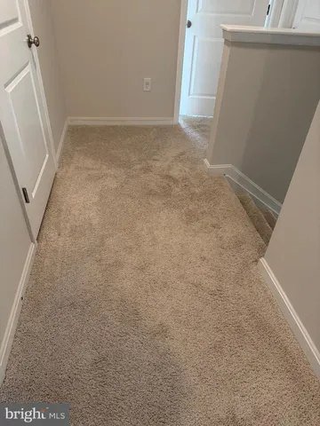 an empty room with a fireplace