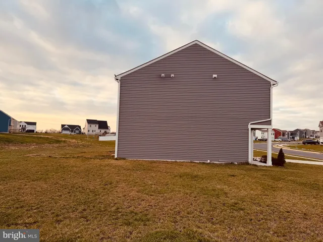 a front view of a house with beach