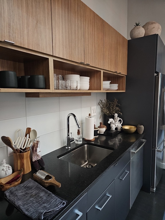 319 A Street, Unit 307 Boston, MA 02210 - Photo 17 of 25 a kitchen with a sink and cabinets